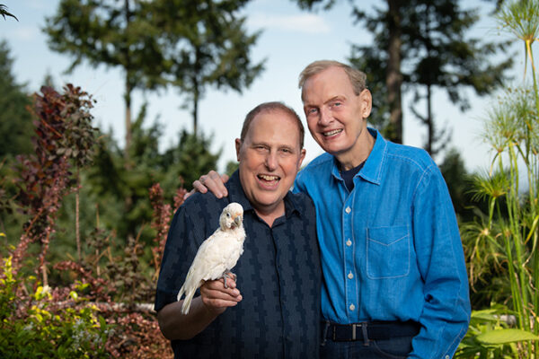 Walter Jaffe and Paul King of White Bird Dance, with Barney, the white bird.